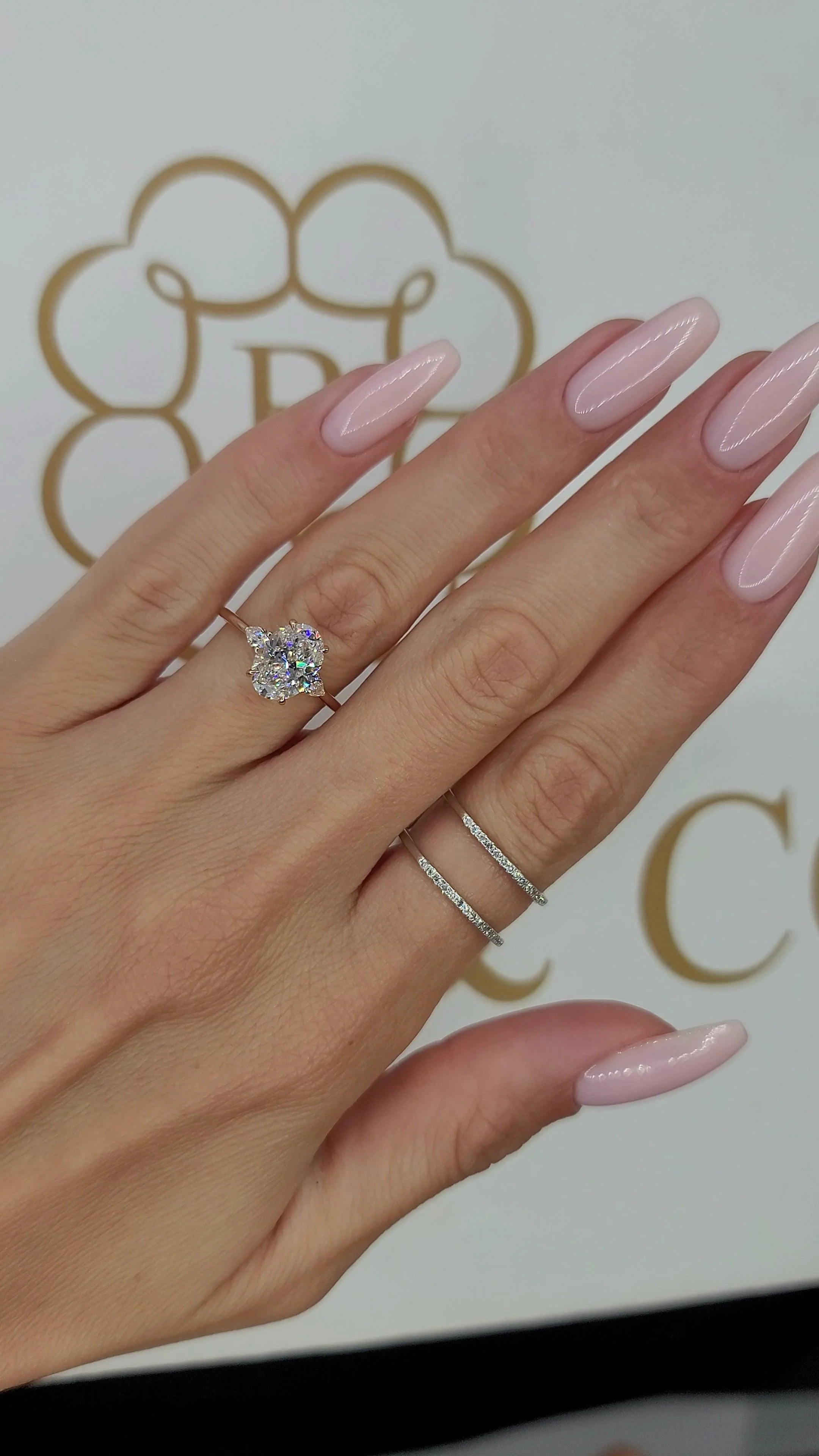 2.37 Carats Lab Grown Oval Cut with Pear Shape Side Stones Diamond Engagement Ring in Rose Gold - Image 2